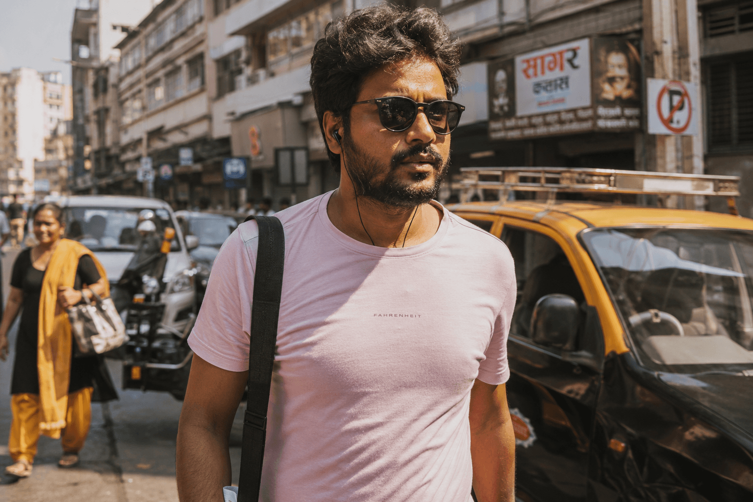 Indian man wearing a pastel cotton t-shirt in a Mumbai street style